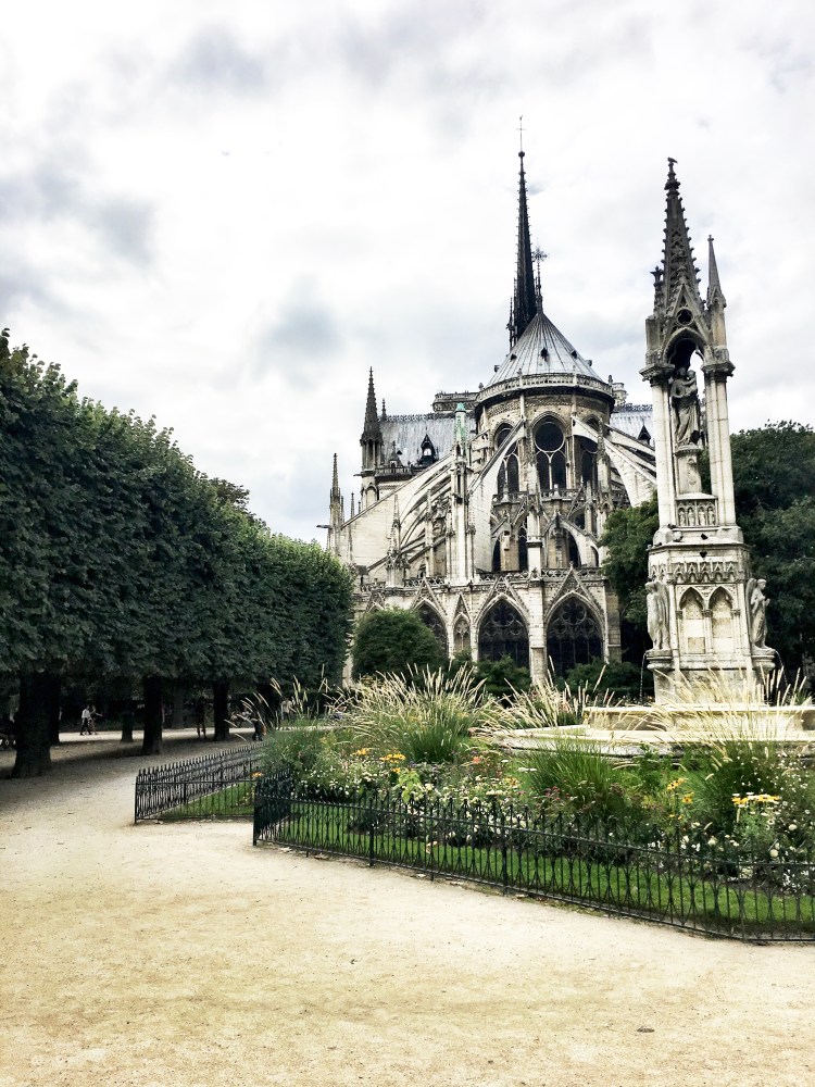 Notre Dame cathedral in Paris, France view with spire by Mia Lupo